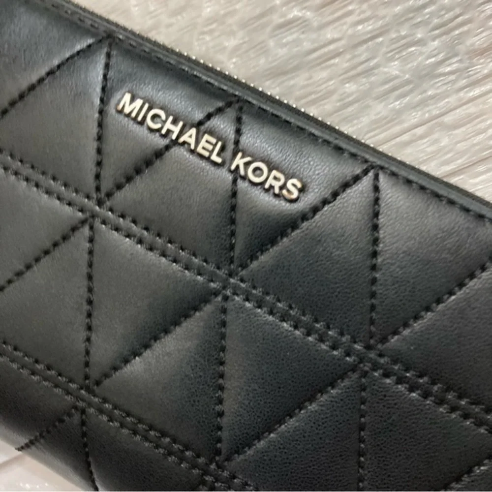 Michael Kors quilted zipper clutch bag
